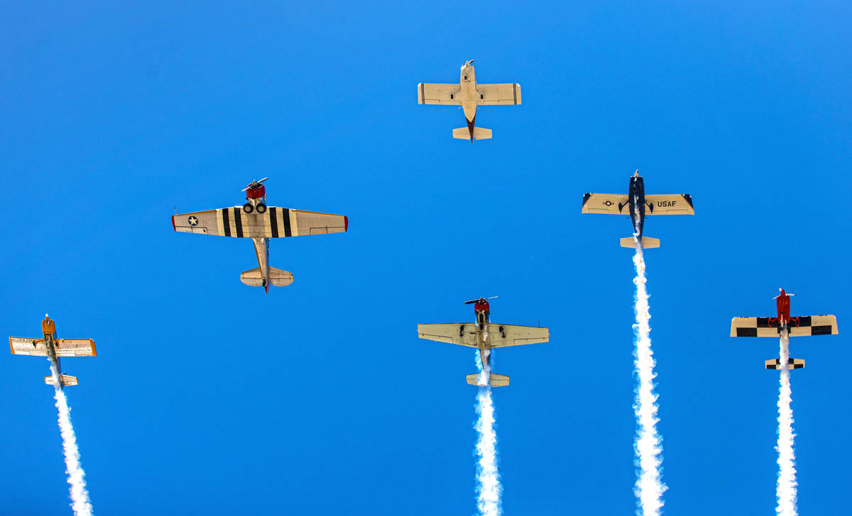 Members of the Veterans Pilots Group perform a flyover during a Memorial Day ceremony at Vetera ...