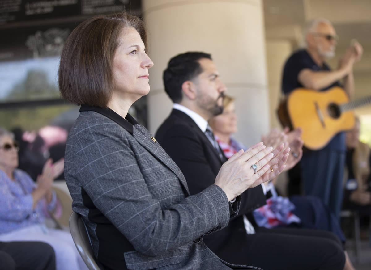 Sen. Catherine Cortez Masto, D-Nev., left, listens to a speaker during a Memorial Day ceremony ...