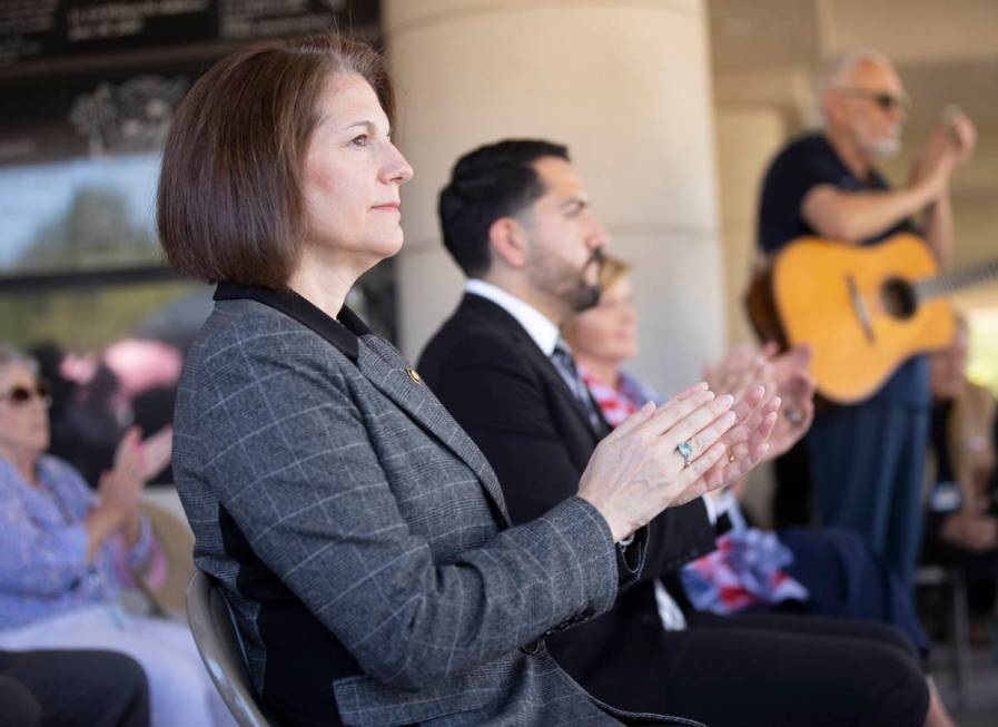 Sen. Catherine Cortez Masto, D-Nev., left, listens to a speaker during a Memorial Day ceremony ...