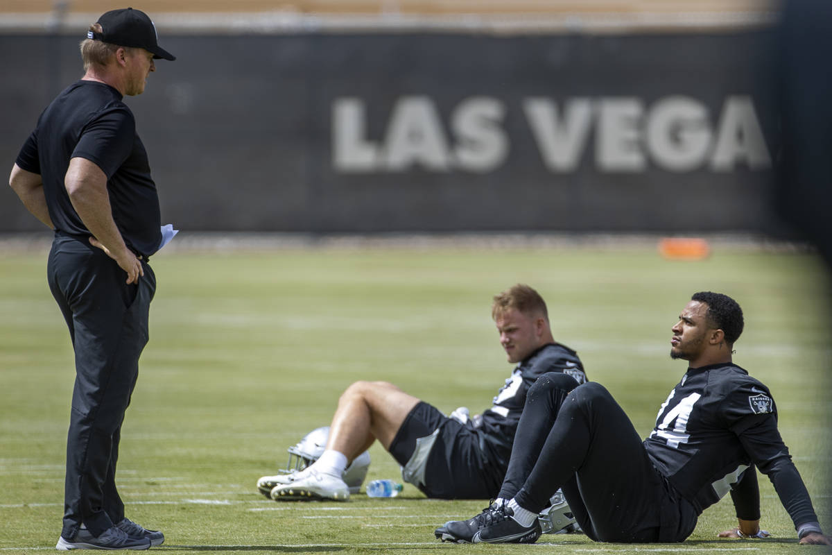 Head Coach Jon Gruden talks with safety Johnathan Abram (24) during a Las Vegas Raiders open pr ...