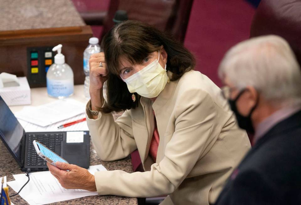 FILE - In this July 14, 2020, file photo Nevada Assemblywoman Robin Titus looks toward a collea ...
