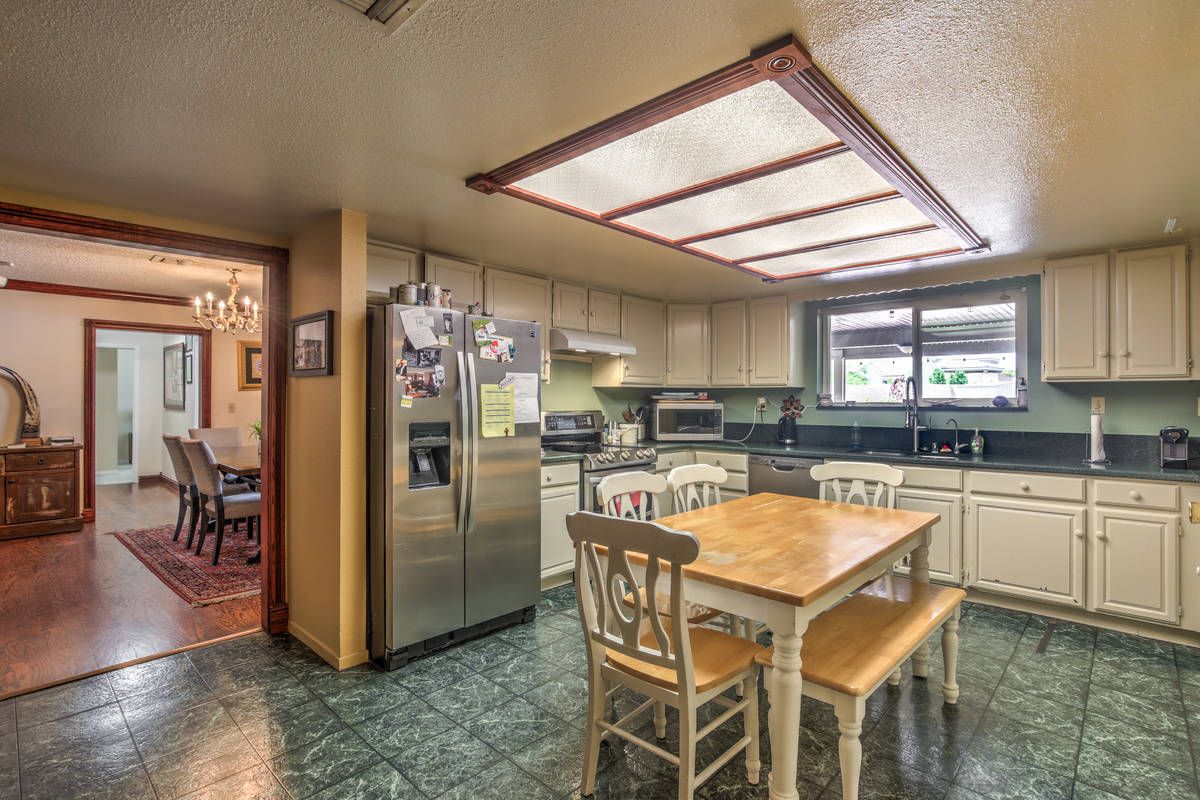 The kitchen area of 9840 W. Ann Road. (Neon Sun Photography) The kitchen area of ...