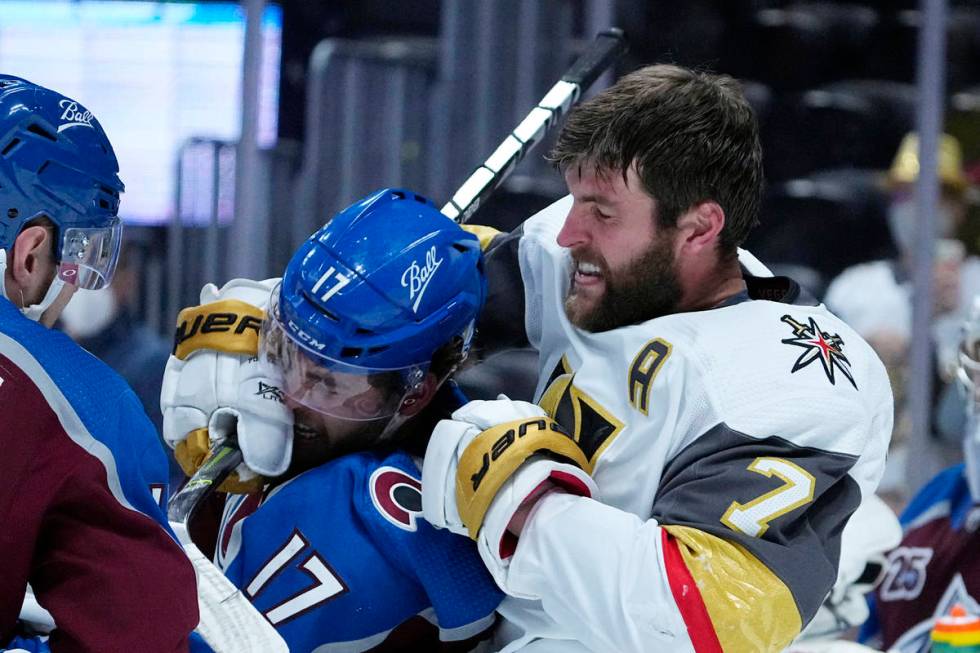 Vegas Golden Knights defenseman Alex Pietrangelo (7) fights with Colorado Avalanche center Tyso ...