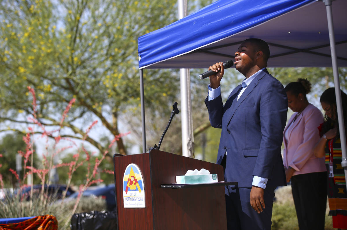 Christian Shelton sings the national anthem during a flag-raising ceremony ahead of Juneteenth, ...