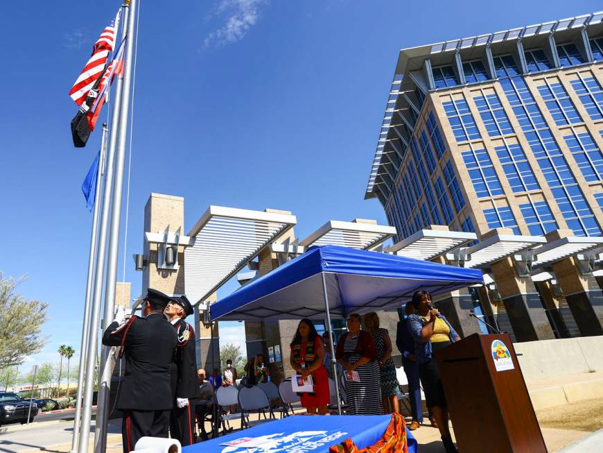 Members of the North Las Vegas Fire Department Honor Guard raise the Juneteenth flag as Edina F ...