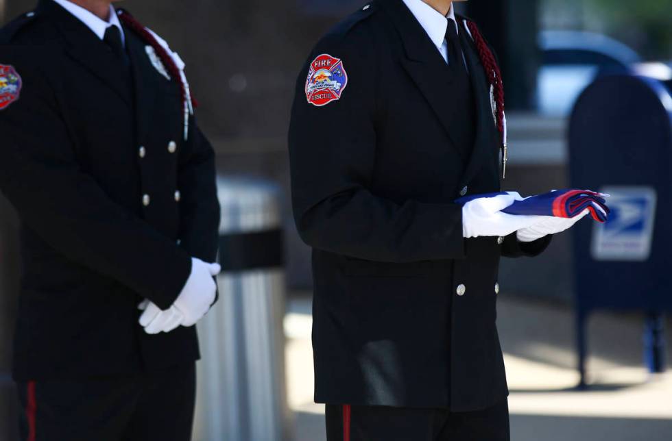 Cameron Hughes, of the North Las Vegas Fire Department Honor Guard, holds the Juneteenth flag b ...