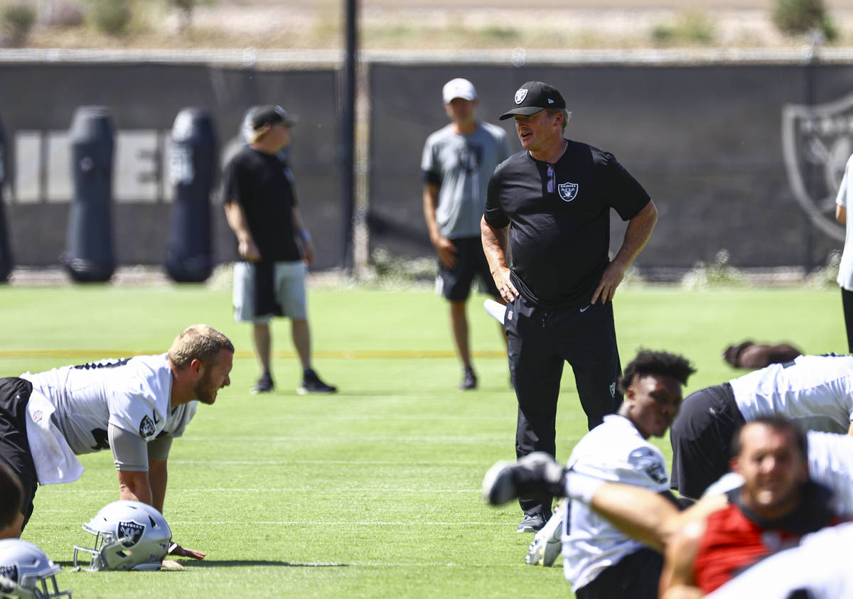 Raiders head coach Jon Gruden talks with players during NFL football practice at Raiders headqu ...