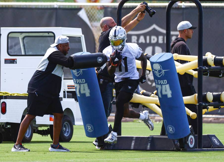 Raiders wide receiver Henry Ruggs III (11) runs through drills during NFL football practice at ...