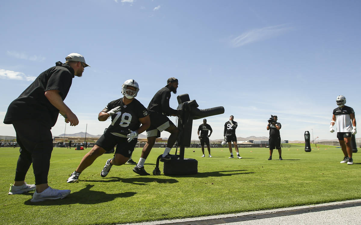 Raiders defensive tackle Niles Scott (78) runs through drills during NFL football practice at R ...