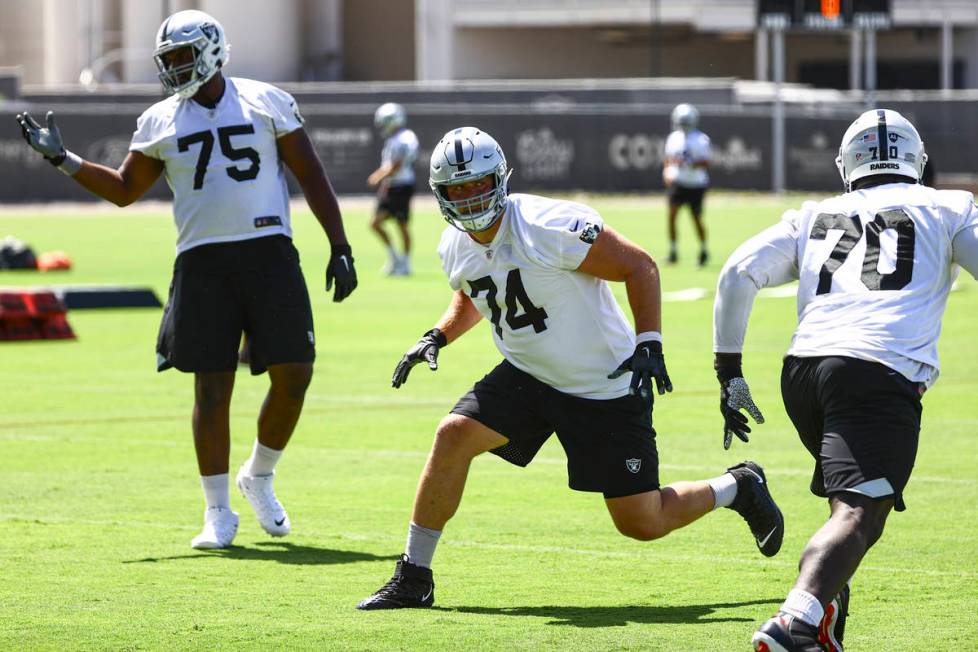 Raiders offensive tackle Kolton Miller (74) runs through drills during NFL football practice at ...