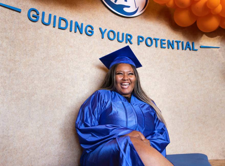 Heavenly Johnson shares a laugh with family while waiting for the start of graduation for Beaco ...