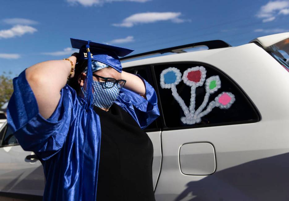 Jezaqua Norman straightens her cap before graduation for Beacon Academy of Nevada on Wednesday, ...