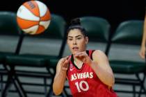 Las Vegas Aces' Kelsey Plum reaches for the ball during the first half of a WNBA basketball gam ...