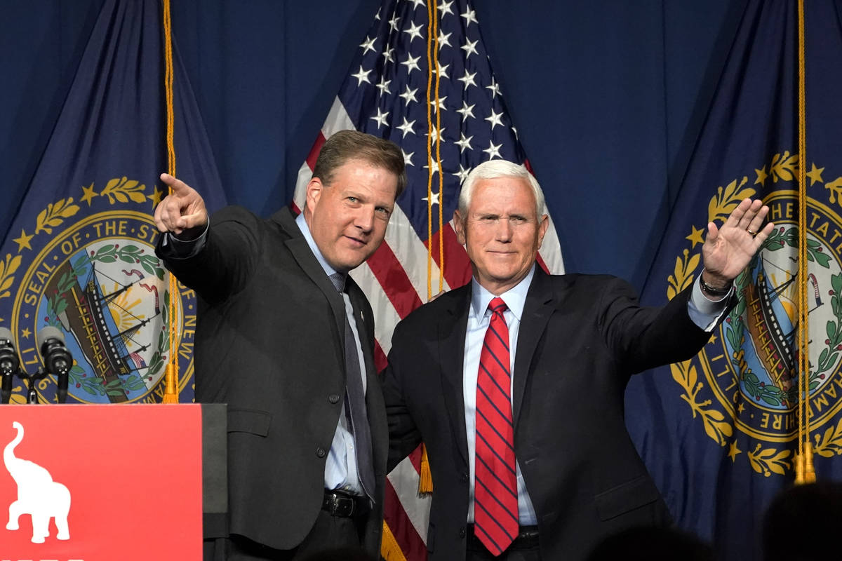 Former Vice President Mike Pence, right, waves as N.H. Gov. Chris Sununu introduces him at the ...