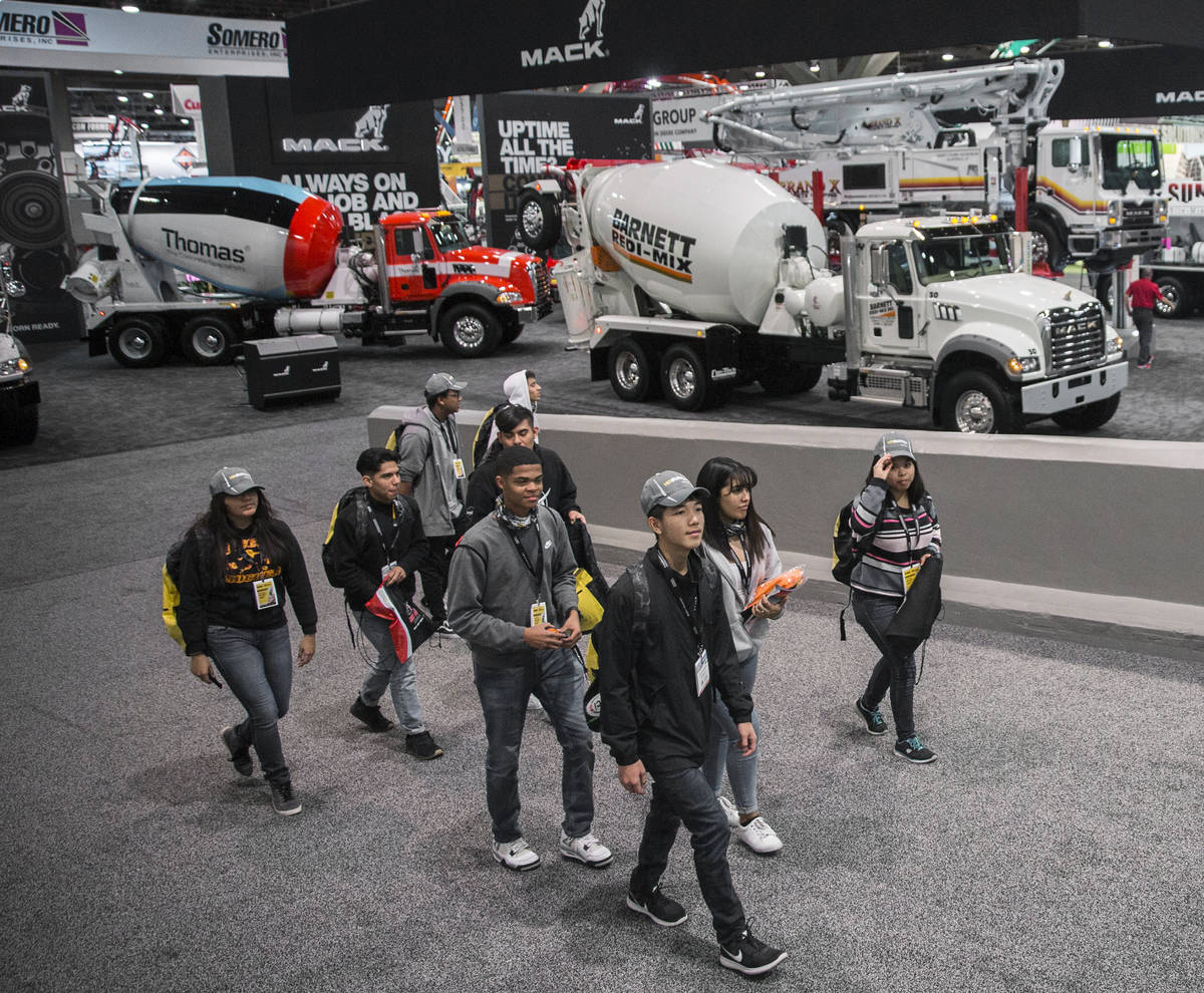 Convention goers explore the Central Hall during the last day of World of Concrete on Friday, J ...