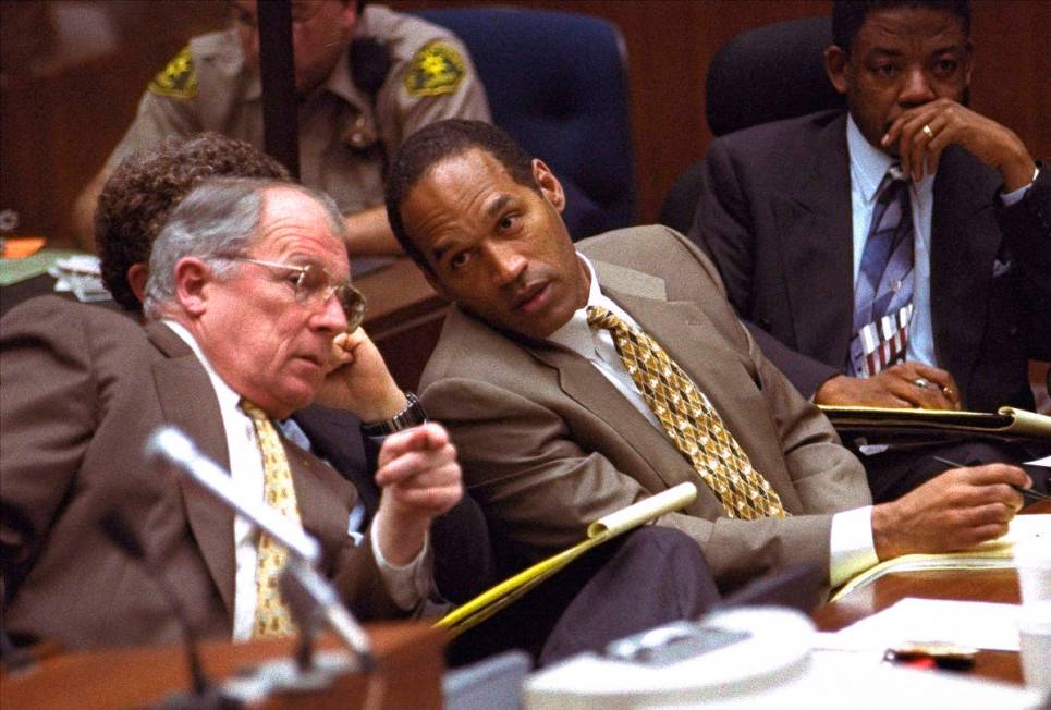 In this Friday, June 30, 1995, file photo, O.J. Simpson and defense attorney F. Lee Bailey, lef ...