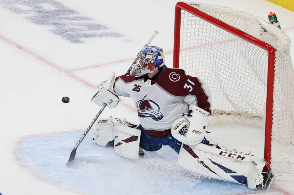 Colorado Avalanche goaltender Philipp Grubauer (31) defends a shot against the Vegas Golden Kni ...