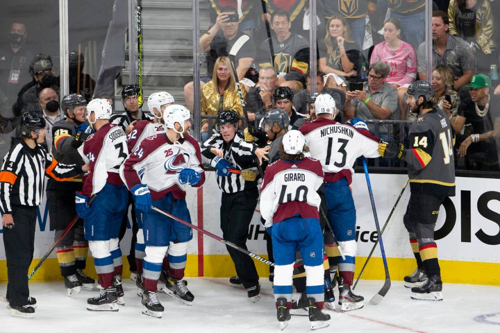 A referee breaks up a conflict between Golden Knights right wing Keegan Kolesar (55) and Avalan ...