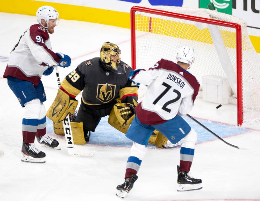 Avalanche right wing Mikko Rantanen (96) and right wing Joonas Donskoi (72) watch as Rantanen s ...