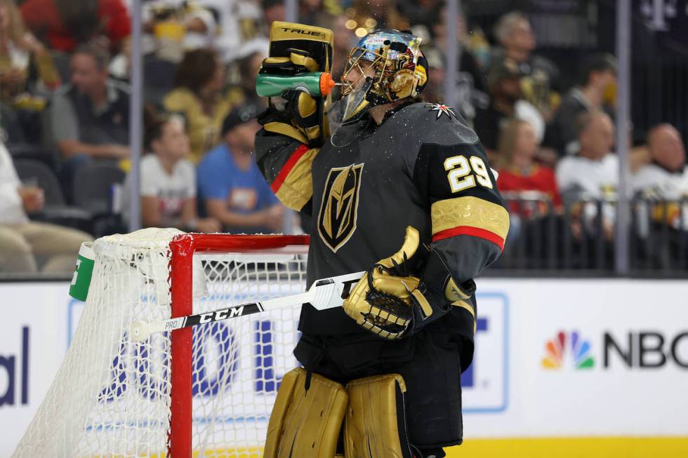 Vegas Golden Knights goaltender Marc-Andre Fleury (29) drinks water during a break in the secon ...