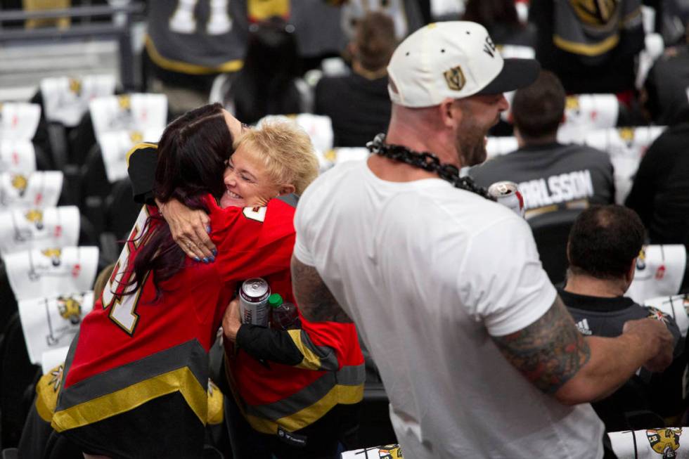 Golden Knights fans embrace before Game 3 of a second-round NHL hockey Standley Cup playoff ser ...