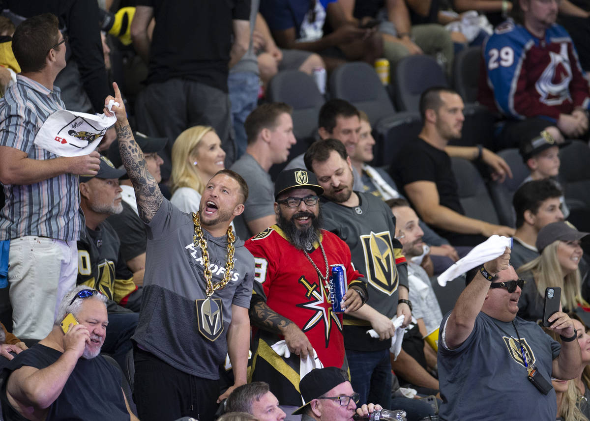 Fans cheer after the Golden Knights take the lead in the third period of Game 3 of a second-rou ...