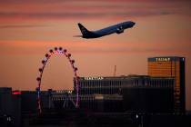 The crews of three jets flying into McCarran International Airport on Friday night reported tha ...
