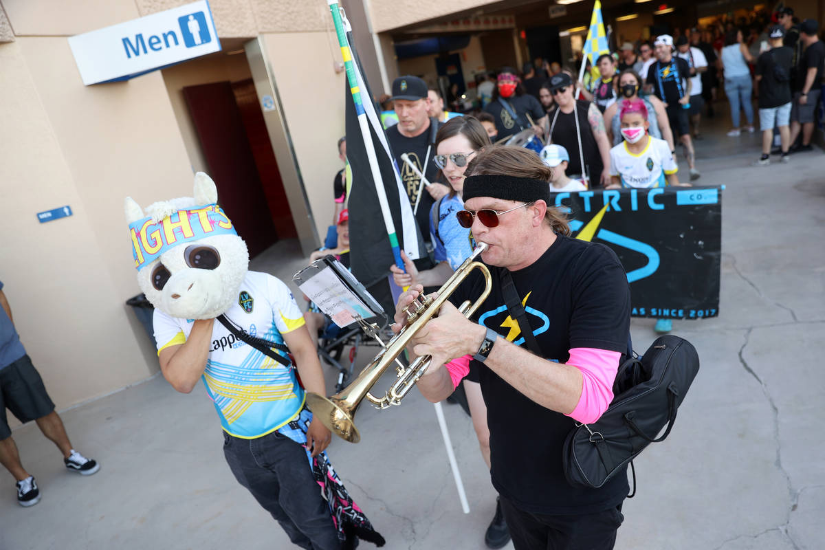 Jason Evers plays music as he enters Cashman Field for a USL Championship soccer game between t ...