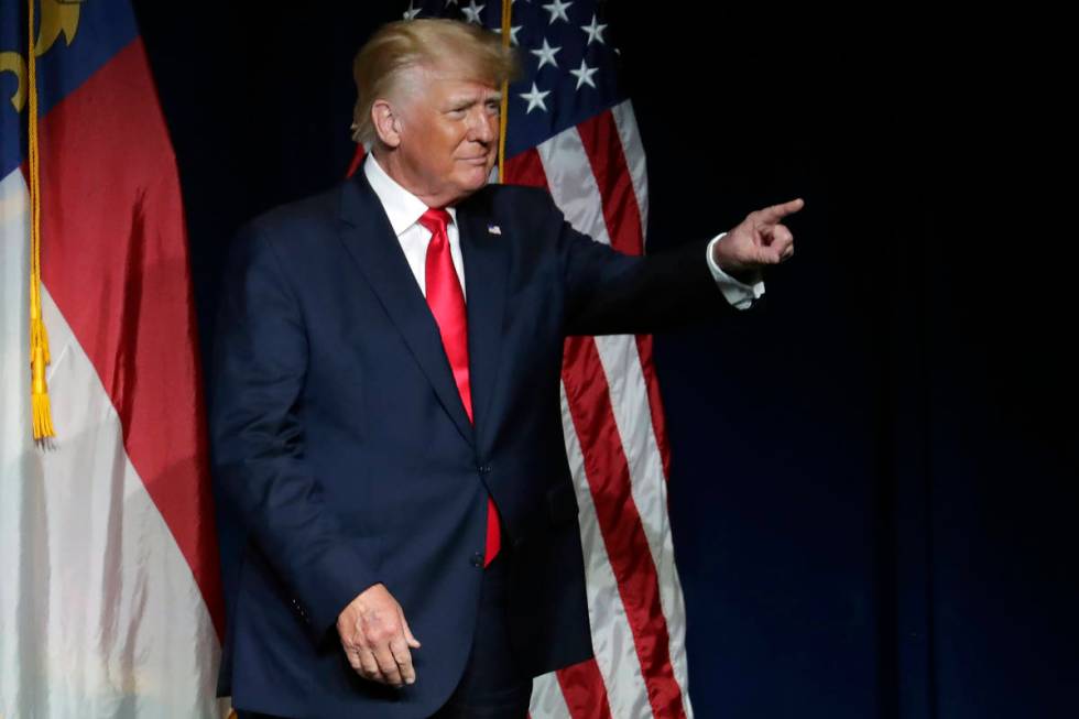 Former President Donald Trump acknowledges the crowd as he speaks at the North Carolina Republi ...