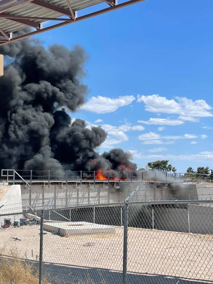 Smoke billows Saturday, June 5, 2021, from a fire on railroad tracks at a bridge in North Las V ...