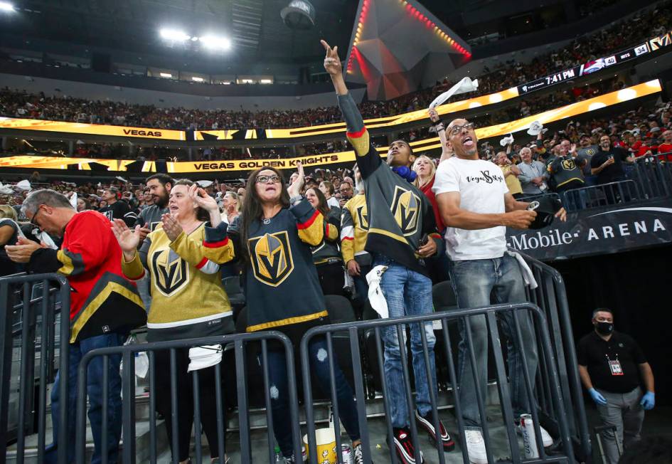 Golden Knights fans celebrate a hat trick by Jonathan Marchessault, not pictured, during the th ...