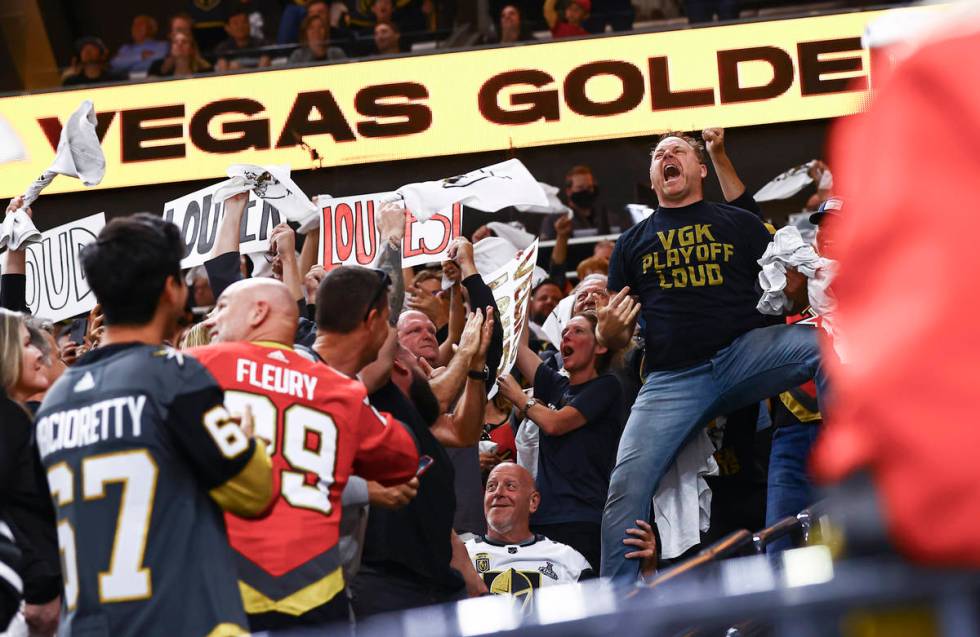 Entertainer Cameron Hughes, right, hypes up the crowd during the third period of Game 4 of an N ...