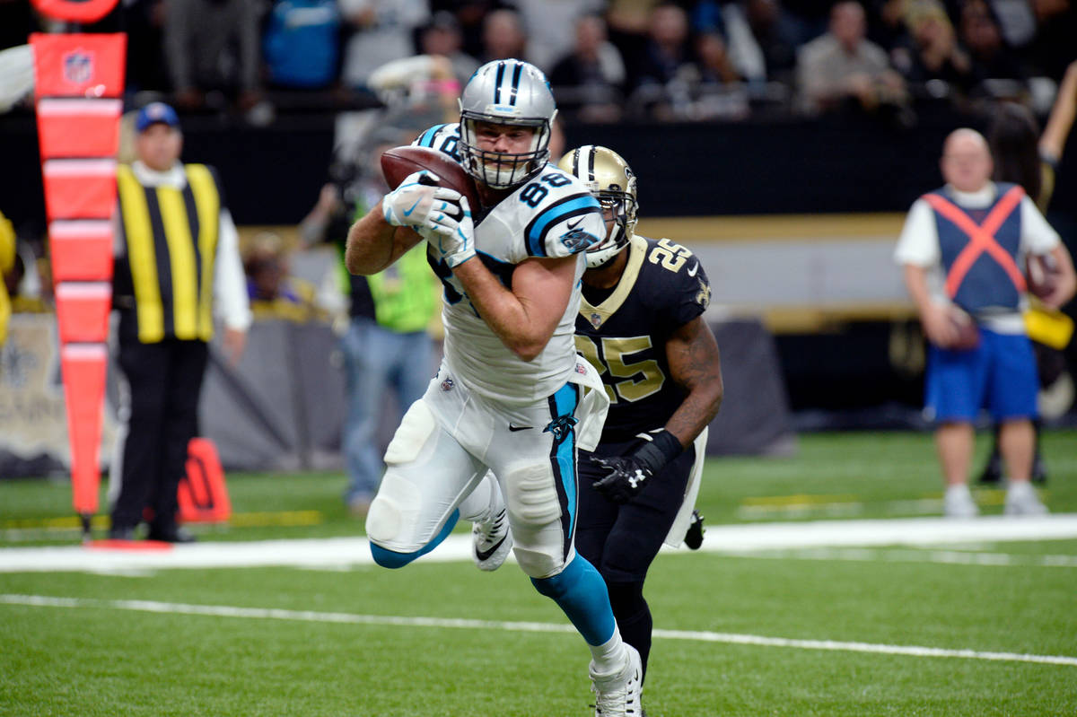 Carolina Panthers tight end Greg Olsen (88) pulls in a touchdown reception in front of New Orle ...