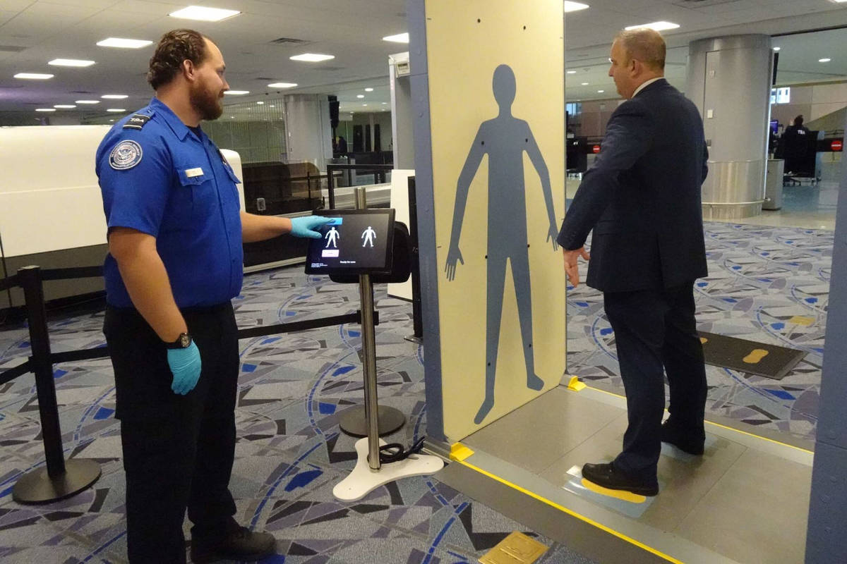 A Transportation Security Administration officer demonstrates new security technology at McCarr ...