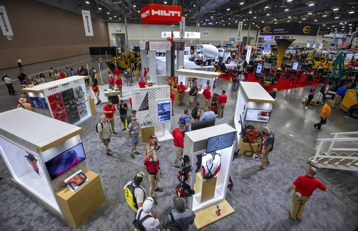 World of Concrete 2021 attendees check out some of the products offered by Hilti representative ...