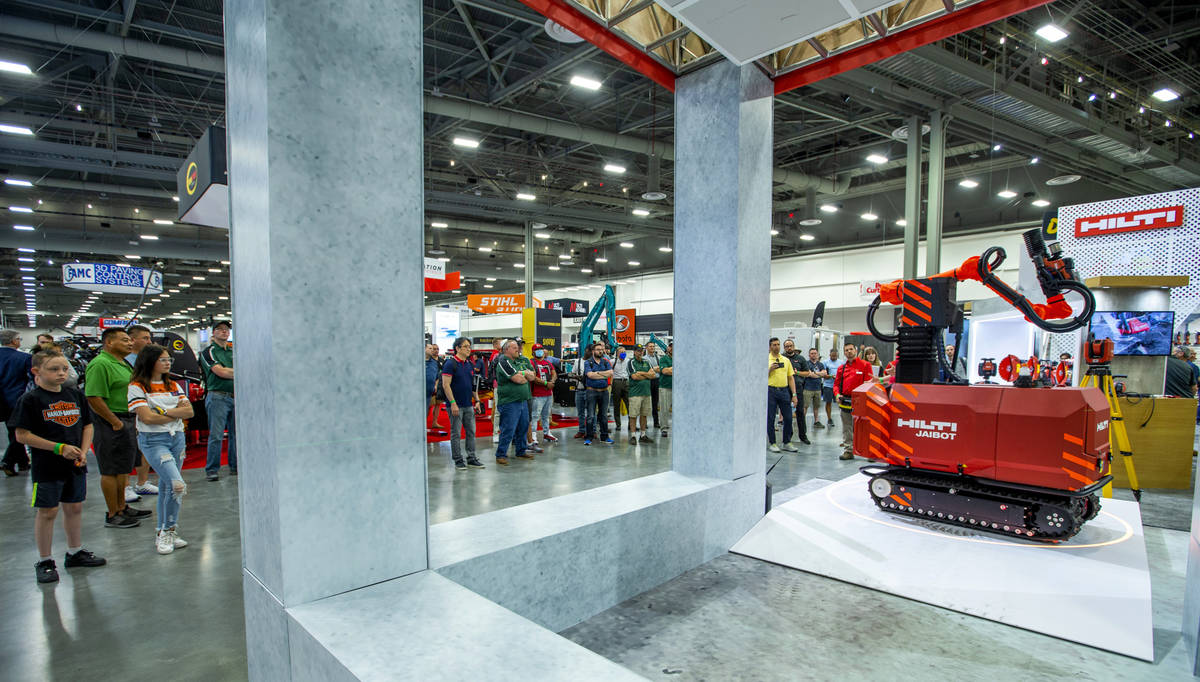 World of Concrete 2021 attendees watch a demonstration of the Hilti Jaibot construction robot a ...