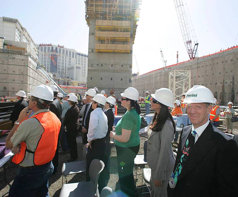 New York developer Ian Bruse Eichner, right, stands with other VIP guests and construction work ...