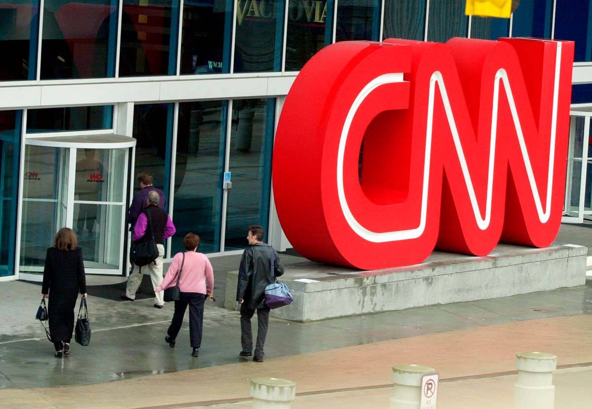 This Jan. 17, 2001 file photo shows people entering CNN Center, the headquarters for CNN, in do ...