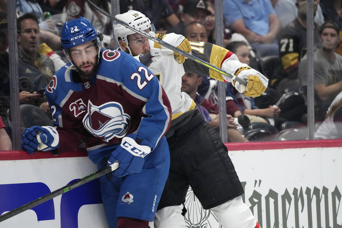 Vegas Golden Knights center Nicolas Roy, right, cheks Colorado Avalanche defenseman Conor Timmi ...