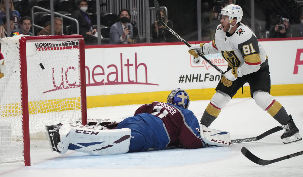 Vegas Golden Knights center Jonathan Marchessault, right, scores a goal past Colorado Avalanche ...