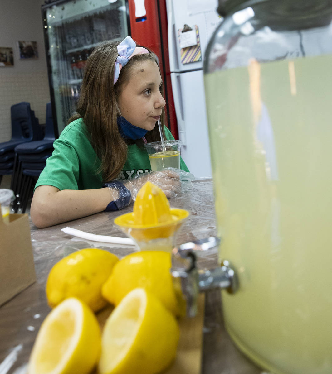 Kay Carl Elementary School student, Tantum Hales, 10, drinks lemonade she and her schoolmates ...