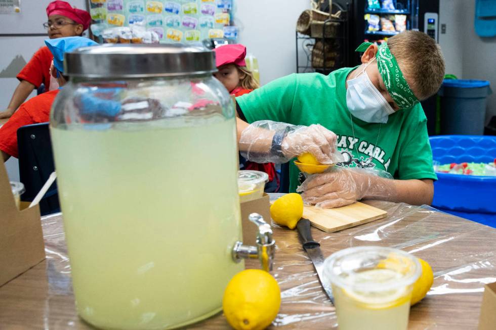 Kay Carl Elementary School student, Shawn Davignon, 11, squeezes a lemon to make lemonade durin ...