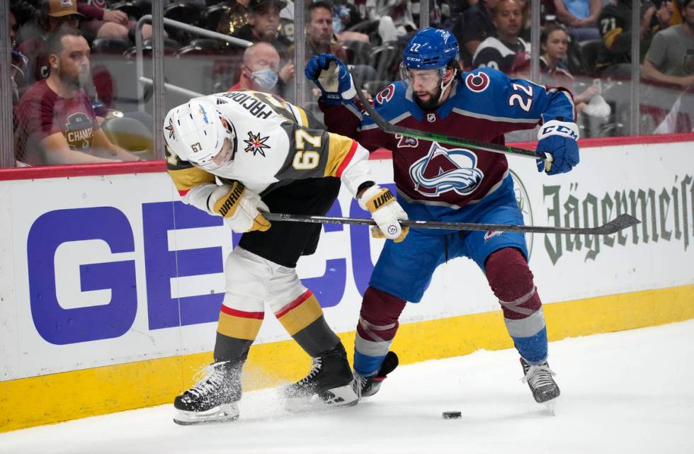 Vegas Golden Knights left wing Max Pacioretty, left, fights for control of the puck with Colora ...