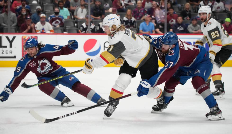 Vegas Golden Knights center William Karlsson, center, drives between Colorado Avalanche defense ...