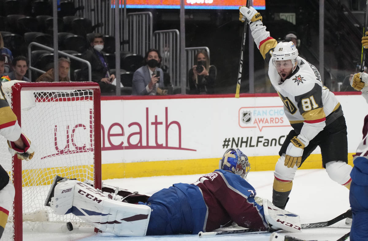 Vegas Golden Knights center Jonathan Marchessault, right, reacts after soring a goal past Color ...