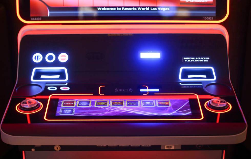 A slot machine with wireless phone charging capabilites is seen on the casino floor is seen dur ...