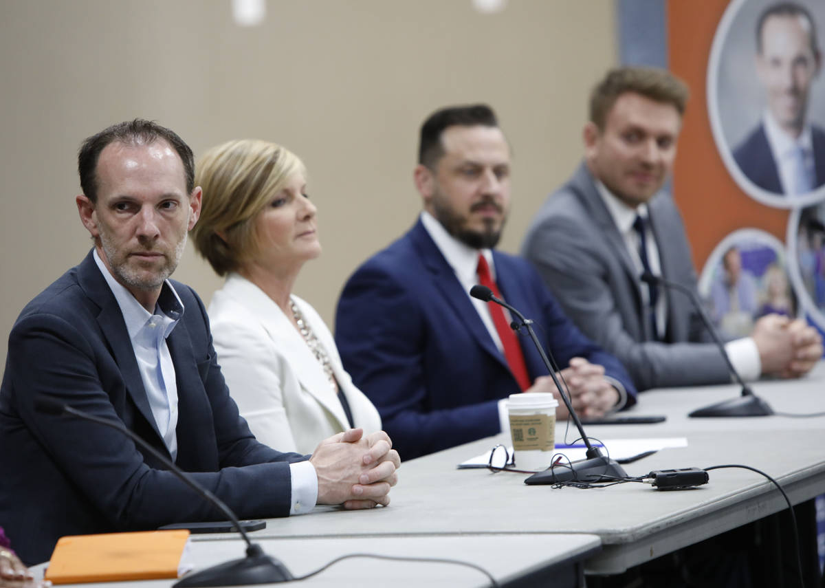 Clark County Commissioner Justin Jones, left, takes part in a Housing Resource Talk at Desert B ...