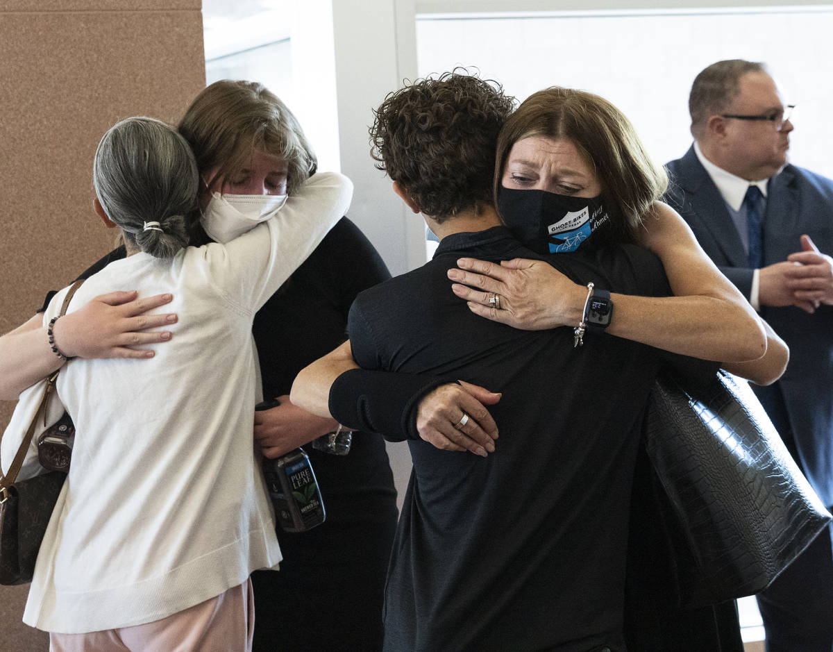 Angela Ahmet, right, and her daughter Jasmine, 17, are comforted by family members after Jordan ...