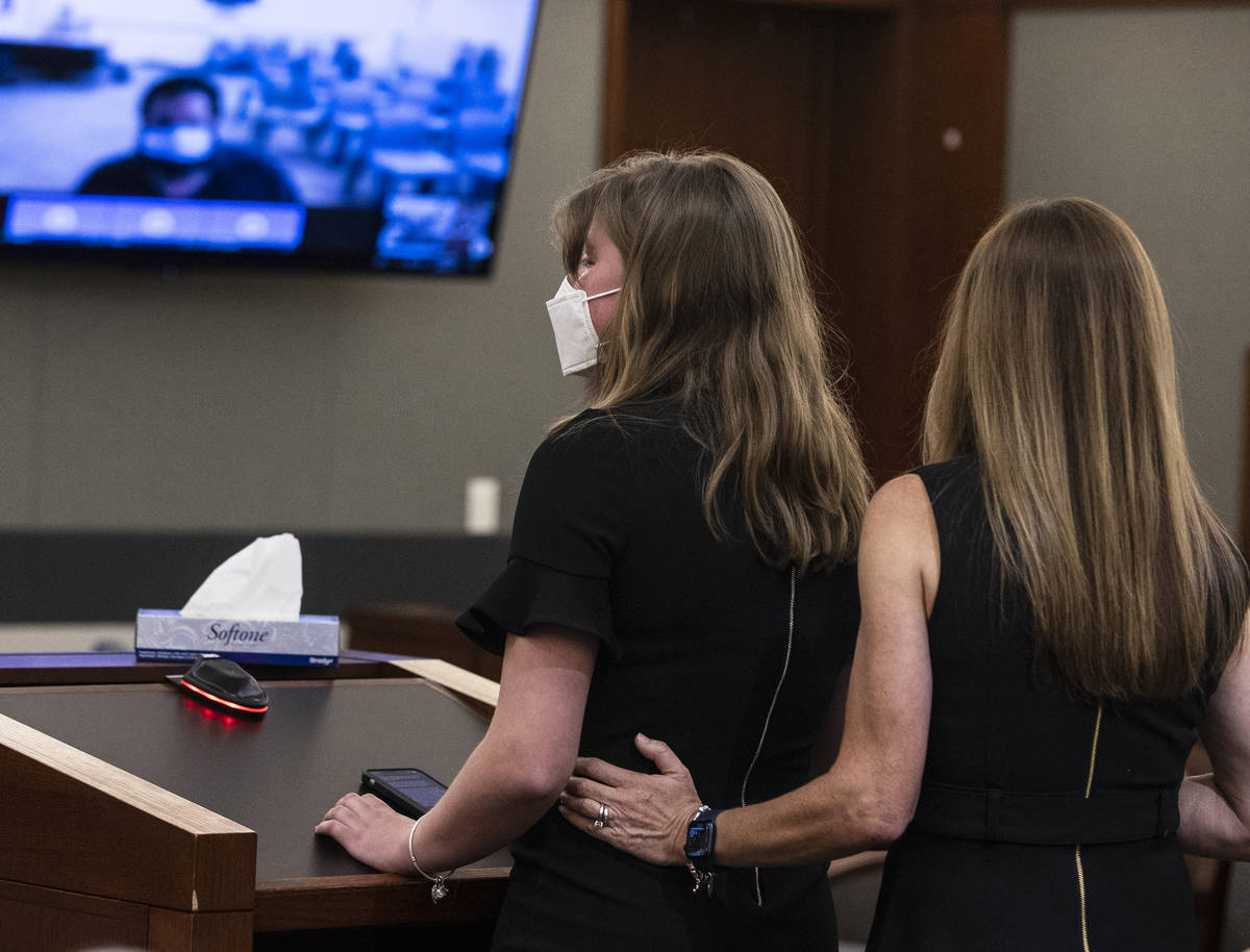 Angela Ahmet, right, comforts as her daughter Jasmine, 17, as she delivers her victim impact st ...