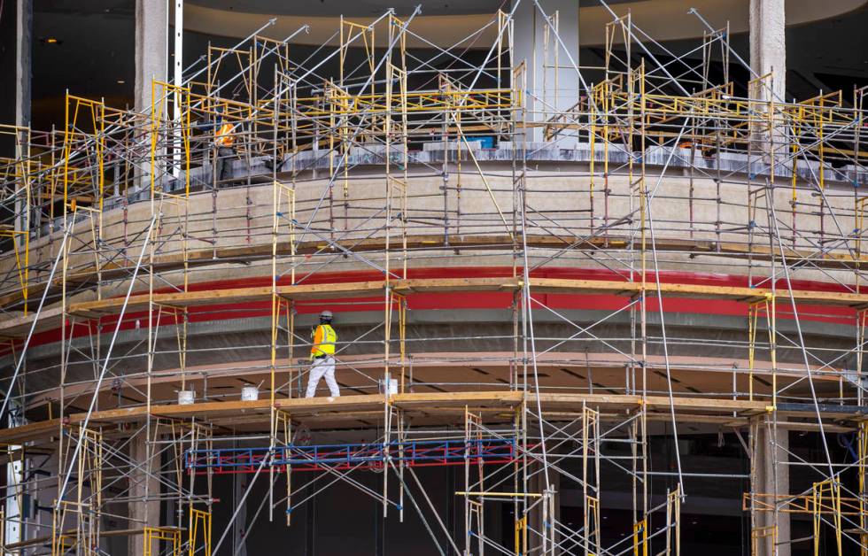 Crews work on the exterior of Resorts World as construction continues on Tuesday, April 27, 202 ...